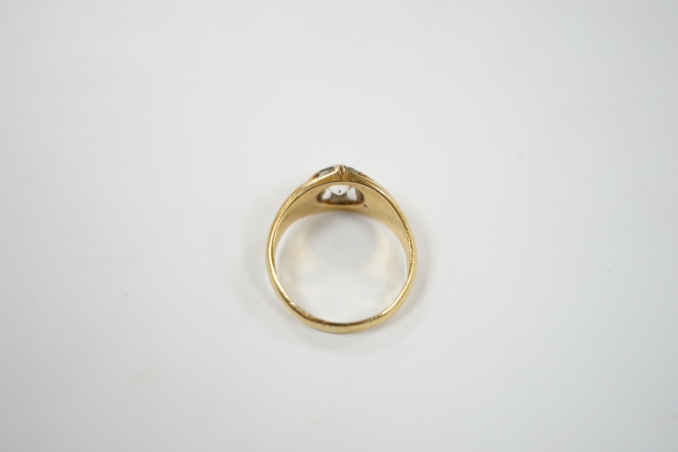 A late Victorian 18ct gold and claw set solitaire diamond ring, size P, gross weight 6.1 grams